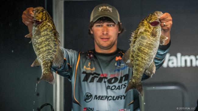 Brandon Perkins hoists two of the slammer smallies he rode to second place and the Cup. 