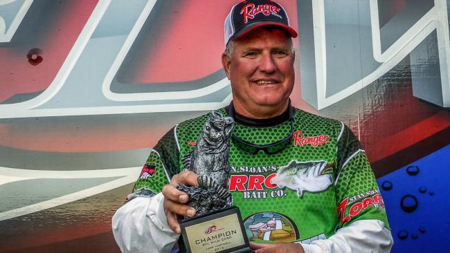Mike Devere proudly displays his BFL Wild Card trophy.
