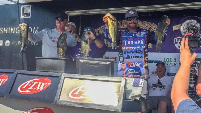 FLW Tour pro Scott Martin and his teammates MN Vikings Offensive Coordinator Pat Shurmur and VIP Jimmy Robison show off their limit.